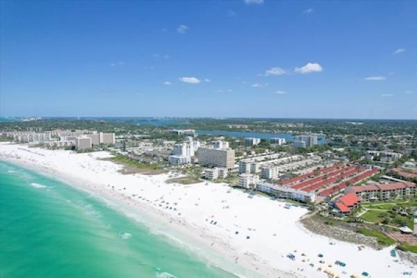 aerial view of the beach with view of Casa Blanca in distance