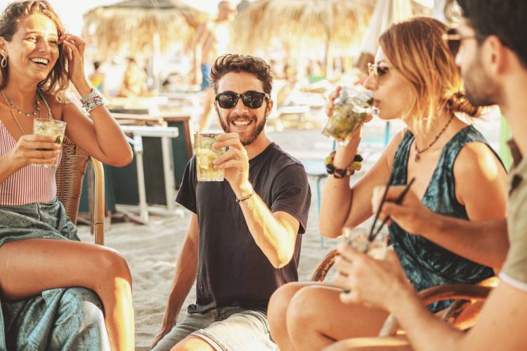 group of friends at a bar on the beach